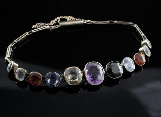 An early 20th century gold and multi gem bracelet,